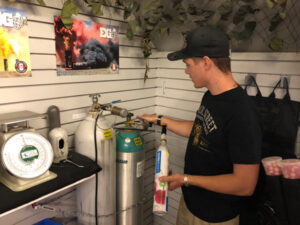 Refilling a SodaStream CO2 cylinder at Nicol Street Pawnshop